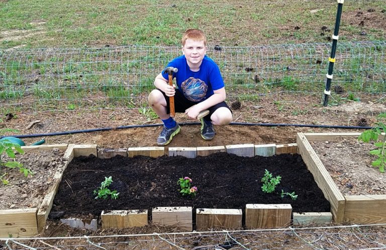 Kids building flower bed
