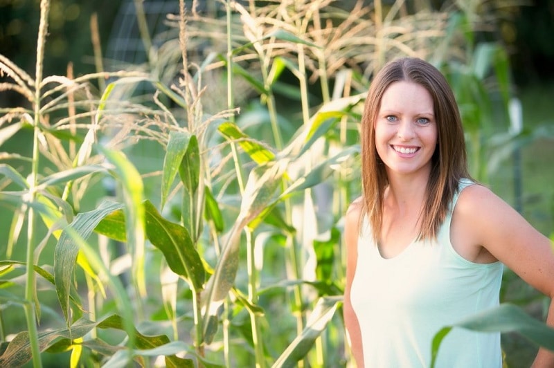 Jill in front of her corn field